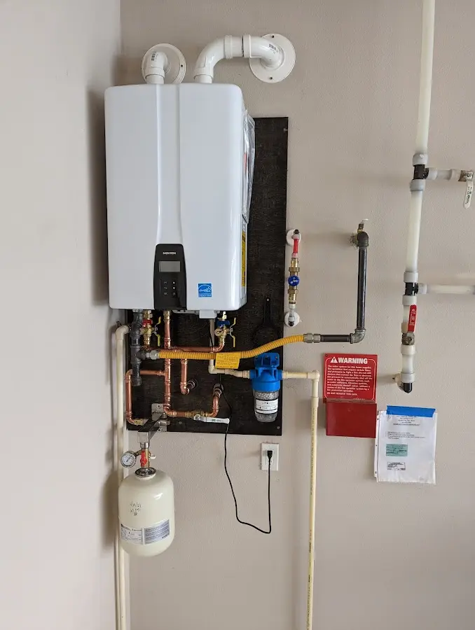 Professional plumber installing copper piping in a Sheboygan home